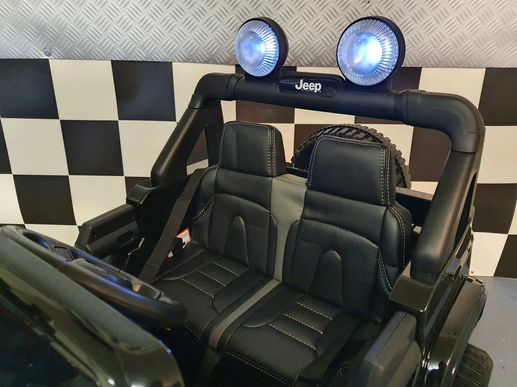 Auto elettrica per bambini Jeep Wrangler 12V 4WD nera metallizzata
